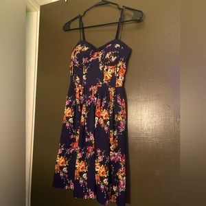 Navy blue with flowers. Comes right above the knees.